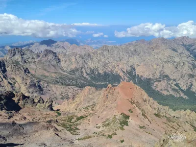 View west from the summit of Cinto, Calvi in the distance View west from the summit of Cinto, Calvi in the distance