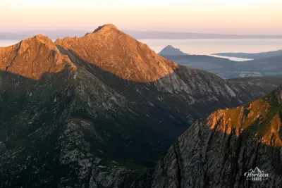 Goatfell, highest summit of the Isle of Arran, at sunset Goatfell, summit of the Isle of Arran, at sunset