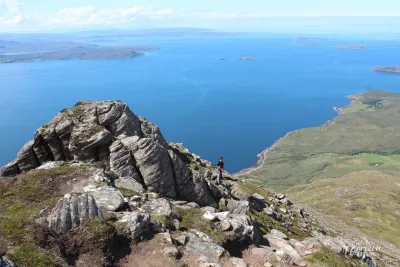 Arriving on the ridge of Ben More Coigach, with the Summer Isles in the background