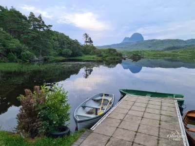 Loch Druim Suardalain and Suilven silhoutte in background Loch Druim Suardalain and Suilven silhoutte in background