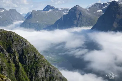 A small opening in the sea of clouds allows a glimpse of the fjord! A small opening in the sea of clouds allows a glimpse of the fjord!