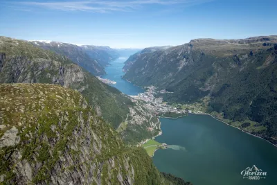 The emerald lake Sandvinsvatnet and Hardangerfjord, with the summit of Jordalsnuten on the left (drone shot) The emerald lake Sandvinsvatnet and Hardangerfjord, with the summit of Jordalsnuten on the left (drone shot)