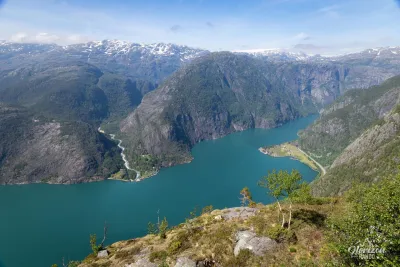 View from Vardahaugen of the magnificent Åkrafjord. The Folgefonna glacier can be seen in the distance on the right View from Vardahaugen of the magnificent Åkrafjord. The Folgefonna glacier can be seen in the distance on the right