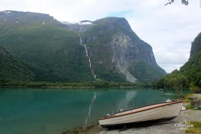 Lake Lovatnet and Ramnefjellfossen waterfall Lake Lovatnet and Ramnefjellfossen waterfall