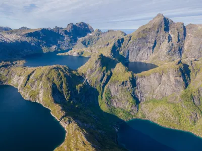 Hermannsdalstinden (1029 m) and many high altitude lakes (drone shot) Hermannsdalstinden (1029 m) and many high altitude lakes (drone shot)
