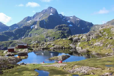 Munkebu lake and huts in front of Hermannsdalstinden (1029 m) Munkebu lake and huts in front of Hermannsdalstinden (1029 m)