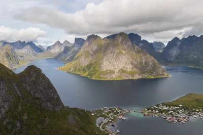 Olstinden divides the fjords of Kjerkfjorden and Vorfjorden Olstinden separates the fjords of Kjerkfjorden and Vorfjorden