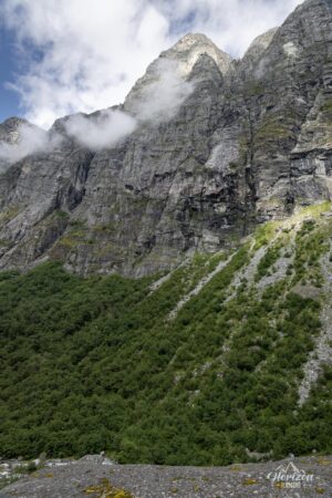 Valley framed by impressive cliffs Valley framed by impressive cliffs