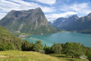 The impressive Skipeddalshyrna (1,710 m) and the village of Hjelle The impressive Skipeddalshyrna (1,710 m) and the village of Hjelle